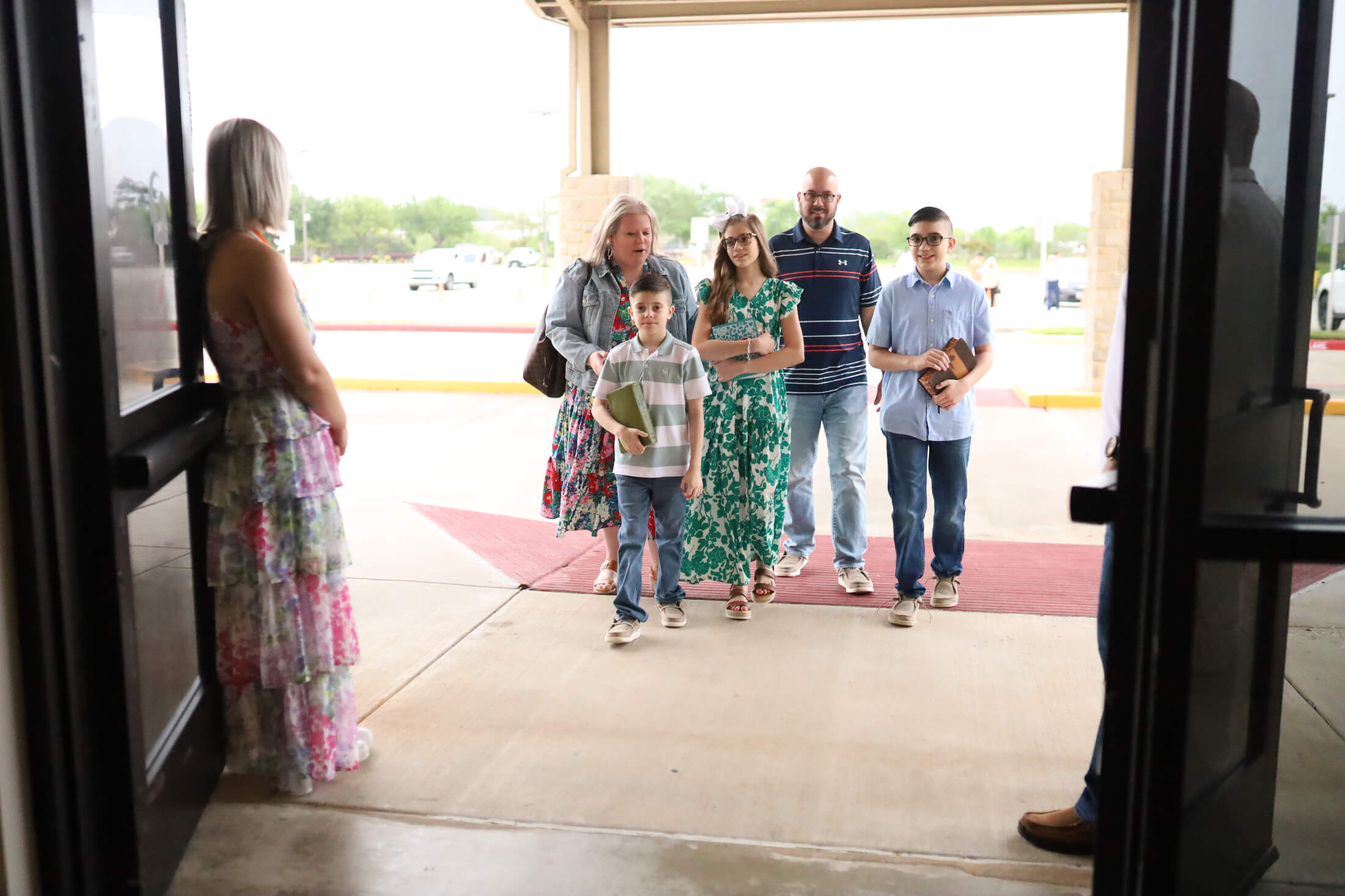 family walking into church